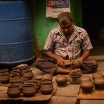 Potter mending pots