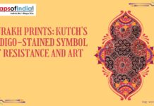 Ajrakh Prints Kutch’s Indigo-Stained Symbol of Resistance and Art Illustrative banner featuring traditional Ajrakh print patterns with the title “Ajrakh Prints: Kutch’s Indigo-Stained Symbol of Resistance and Art,” highlighting the cultural heritage of Gujarat’s block-printing craft.