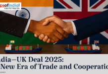 India–UK Deal 2025: A New Era of Trade and Cooperation Two businessmen shaking hands in front of the Indian and UK flags, symbolizing the India–UK Deal 2025, with cargo ships representing trade and cooperation.