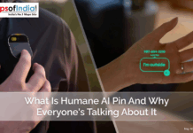 What Is Humane AI Pin and Why Everyone’s Talking About It A person using the Humane AI Pin, a wearable device clipped onto clothing, with a projected user interface displaying a message on their hand.