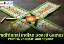 Traditional Indian Board Games: Pachisi, Chaupar, and Beyond A traditional Indian board game setup featuring Pachisi with colorful fabric board, dice sticks, and game pieces placed on a wooden surface.