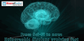 From Sci-Fi to Now: Holographic Displays Evolving Fast A glowing blue 3D holographic brain projection emerging from a flat surface, with the headline "From Sci-Fi to now: Holographic displays evolving fast"