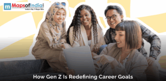 How Gen Z is Redefining Career Goals Group of diverse Gen Z professionals collaborating and discussing career goals while looking at a laptop.