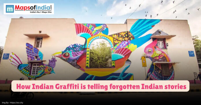 A vibrant graffiti mural of colorful birds painted across a building wall in India, symbolizing how Indian street art is reviving forgotten local stories.