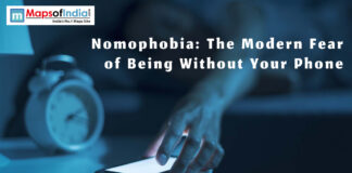 Nomophobia: The Modern Fear of Being Without Your Phone Person anxiously looking at their smartphone, illustrating nomophobia—the fear of being without a phone.
