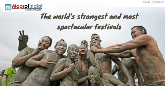 Group of people covered in mud enjoying a unique cultural celebration during one of the world’s strangest and most spectacular festivals