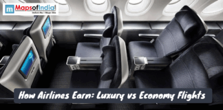 How Airlines Earn: Luxury vs Economy Flights A dark image showing the interior of an airplane cabin with three rows of business or first-class seats with personal entertainment screens.
