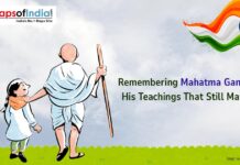 Remembering Mahatma Gandhi: His Teachings That Still Matter A kid with Gandhi Ji and Flag of India in the other corner