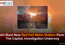 Delhi Blast Near Red Fort Metro Station: Panic in the Capital, Investigation Underway Delhi Police barricades and emergency vehicles block a street at night as flames and smoke rise from a blast near the Red Fort Metro Station in Delhi.
