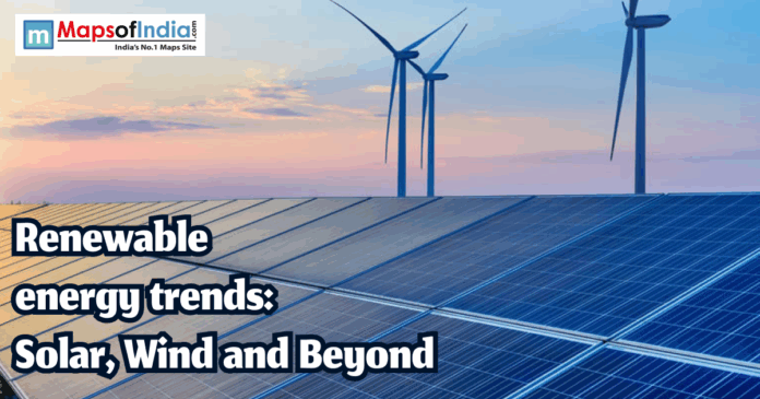 Renewable energy Solar panels and wind turbines at sunset representing renewable energy trends in India.