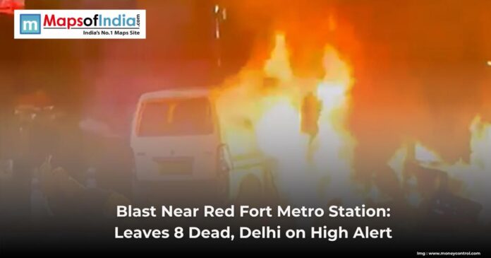 WhatsApp Image 2025-11-10 at 21.49.44_aaf46748 A van engulfed in flames after a blast near Red Fort Metro Station, with emergency alert text overlayed.