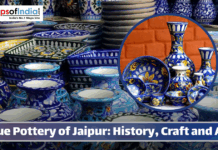 Blue Pottery of Jaipur: History, Craft and Art A vibrant display of Jaipur blue pottery featuring intricately hand-painted bowls, plates, and vases in shades of blue, white, and yellow, showcasing traditional Rajasthani craftsmanship.