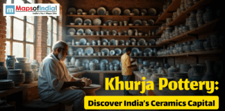 Khurja Pottery: Discover India’s Ceramics Capital A potter works on a clay piece inside a traditional ceramics workshop filled with shelves of handcrafted blue and white pottery in Khurja, India.