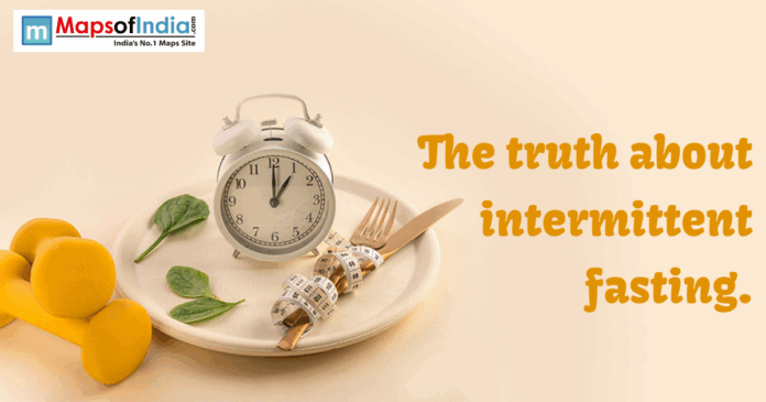 An image showing a clock placed on a plate with a fork, knife, and measuring tape, symbolizing intermittent fasting.