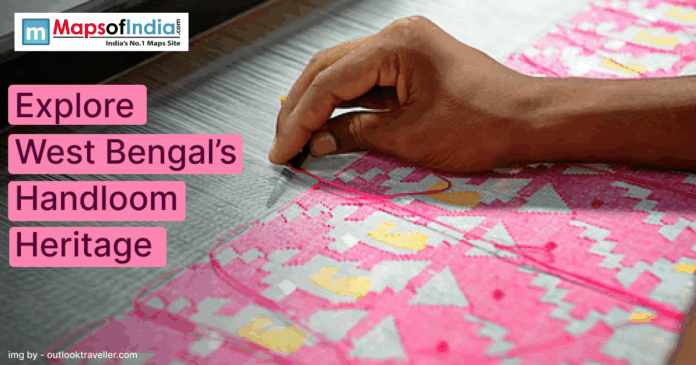 A close-up of a hand weaving a colorful pink and yellow handloom textile, promoting West Bengal’s handloom heritage.