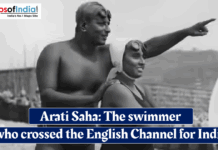 Arati Saha: The Swimmer Who Crossed the English Channel for India Historic black‑and‑white photo of Indian swimmer Arati Saha in a swimsuit on a beach, guided by a man pointing toward the sea, with overlaid text reading “Arati Saha: The swimmer who crossed the English Channel for India.”