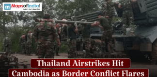 Thailand Airstrikes Hit Cambodia as Border Conflict Flares Soldiers loading a large, possibly rocket-propelled, weapon on a military vehicle with the text overlay "Thailand Airstrikes Hit Cambodia as Border Conflict Flares."