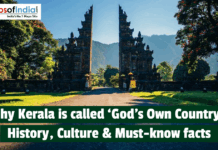 Why Kerala is called God’s Own Country: History, Culture, and Must Know Facts Stone temple gate surrounded by lush greenery in Kerala, symbolizing why Kerala is called God’s Own Country, highlighting its natural beauty and rich cultural heritage.