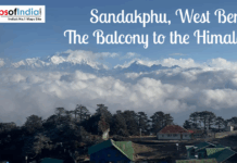 Sandakphu, West Bengal: The Balcony to the Himalayas Panoramic view of Sandakphu in West Bengal, showing snow-covered Himalayan peaks rising above clouds, with forested hills and rooftops in the foreground, known as the Balcony to the Himalayas.
