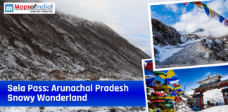 Sela Pass: Arunachal Pradesh’s Wonderland Covered in Snow Collage-style graphic of snow-covered Sela Pass in Arunachal Pradesh with mountain roads, colorful prayer flags, and a gateway, overlaid with the title “Sela Pass: Arunachal Pradesh Snowy Wonderland” and the Maps of India logo.