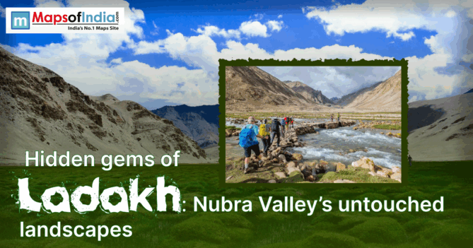 Hikers crossing a rocky stream in Ladakh’s Nubra Valley, surrounded by rugged mountains and green landscapes under a bright sky.