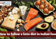 How to Follow a Keto Diet in Indian Food Keto-friendly Indian food spread with salmon, eggs, cheese, nuts, avocado, and leafy greens displayed on a dark background with the title “How to follow a keto diet in Indian food.”
