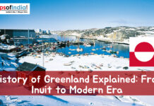 History of Greenland Explained: From Inuit to Modern Era Snow-covered coastal town in Greenland with harbor, boats, and the Greenland flag, featuring the title “History of Greenland Explained: From Inuit to Modern Era.”