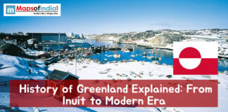 History of Greenland Explained: From Inuit to Modern Era Snow-covered coastal town in Greenland with harbor, boats, and the Greenland flag, featuring the title “History of Greenland Explained: From Inuit to Modern Era.”