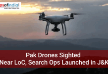Pak Drones Sighted Near LoC, Search Ops Launched in J&K A white quadcopter drone flies over a mountainous landscape at dusk. A red banner at the bottom contains the text: "Pak Drones Sighted Near LoC, Search Ops Launched in J&K." The "Maps of India" logo is in the top left corner.