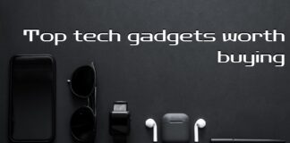 Top Tech Gadgets Worth Buying A flat lay image on a black background featuring a smartphone, sunglasses, a smartwatch, wireless earbuds, and a stylus pen. The text overlay reads "Top tech gadgets worth buying" with a "MapsofIndia" logo in the top left corner.