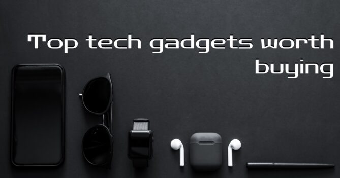 A flat lay image on a black background featuring a smartphone, sunglasses, a smartwatch, wireless earbuds, and a stylus pen. The text overlay reads "Top tech gadgets worth buying" with a "MapsofIndia" logo in the top left corner.