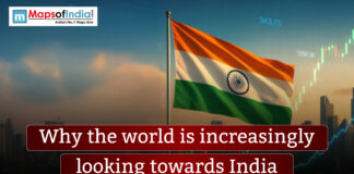 Why The World Is Increasingly Looking Towards India Vibrant green Northern Lights (Aurora Borealis) glowing over a dark, jagged mountain range and reflecting in a calm body of water, with the text "Unique things about the world that still amaze us."