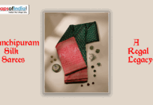 Kanchipuram Silk Sarees: A Regal Legacy Kanchipuram silk saree in green and red with intricate gold zari work, displayed with decorative elements and title text “A Regal Legacy.”