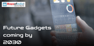 Future Gadgets Coming By 2030 Banner image showing a hand holding a transparent futuristic smartphone interface with the text “Future Gadgets coming by 2030” and Maps of India logo