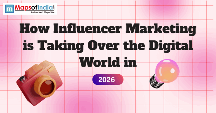 Banner graphic titled “How Influencer Marketing is Taking Over the Digital World in 2026,” featuring a pink grid background, a camera and light bulb illustration, and the Maps of India logo at the top.