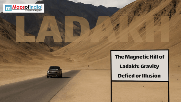 LADAKH (2) Car driving on a desert highway in Ladakh near Magnetic Hill with mountains in the background and a sign reading “The Magnetic Hill of Ladakh: Gravity Defied or Illusion.”