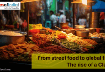 From street food to global fame: The rise of a Classic Colorful Indian street food stall at night displaying fried snacks, chutneys, spices, and fresh ingredients under warm lights, with a banner reading “From street food to global fame: The rise of a Classic."