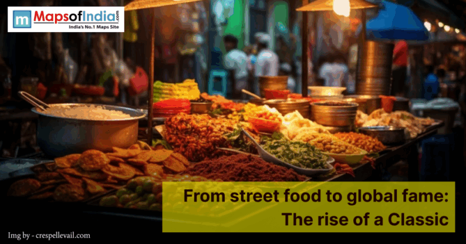 Colorful Indian street food stall at night displaying fried snacks, chutneys, spices, and fresh ingredients under warm lights, with a banner reading “From street food to global fame: The rise of a Classic."