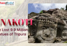 Unakoti: The Lost 9.9 Million Statues of Tripura Large rock-carved face sculpture at Unakoti in Tripura with title text “Unakoti: The Lost 9.9 Million Statues of Tripura” displayed on the image.