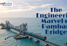 The Engineering Marvel of Pamban Bridge A train crosses the historic Pamban Bridge over the ocean in Tamil Nadu, India