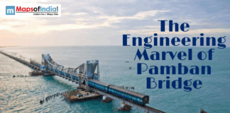 The Engineering Marvel of Pamban Bridge A train crosses the historic Pamban Bridge over the ocean in Tamil Nadu, India