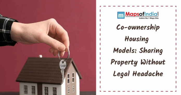 Hand holding house keys above a miniature home, representing co-ownership housing and shared property ownership