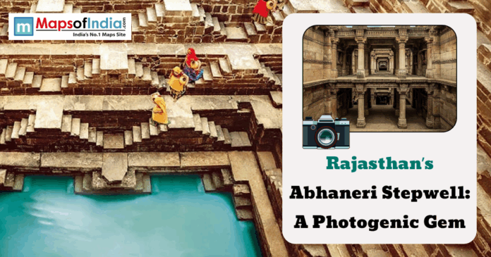 Visitors walking along the geometric steps of Chand Baori at Abhaneri, Rajasthan, with turquoise water below and a graphic highlighting “Rajasthan’s Abhaneri Stepwell: A Photogenic Gem.”