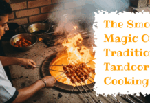 The Smoky Magic Of Traditional Tandoor Cooking A chef in a white uniform prepares skewers of marinated meat over the intense orange flames of a traditional clay tandoor oven. The scene is filled with rising smoke, and a text overlay on the right reads, "The Smoky Magic Of Traditional Tandoor Cooking."