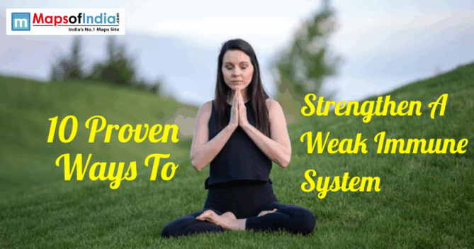 A woman meditating outdoors on grass for immune system health.