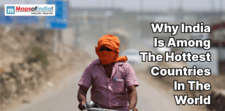 Why India Is Among The Hottest Countries In The World Man riding a bicycle in extreme heat with face covered, highlighting India’s high temperatures and harsh summer conditions.