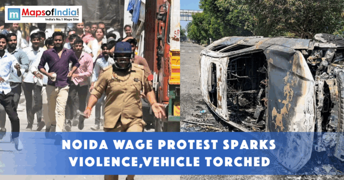 Workers protest in Noida turns violent as police intervene, with a vehicle seen overturned and burned on the road