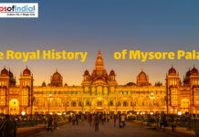The Royal History of Mysore Palace Illuminated Mysore Palace at dusk with visitors, showcasing its royal architecture and grandeur