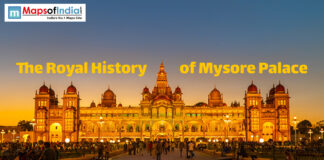 The Royal History of Mysore Palace Illuminated Mysore Palace at dusk with visitors, showcasing its royal architecture and grandeur