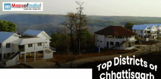 Top Districts of Chhattisgarh Banner image for “Top Districts of Chhattisgarh” showcasing scenic hillside cottages surrounded by lush forests and natural landscapes.